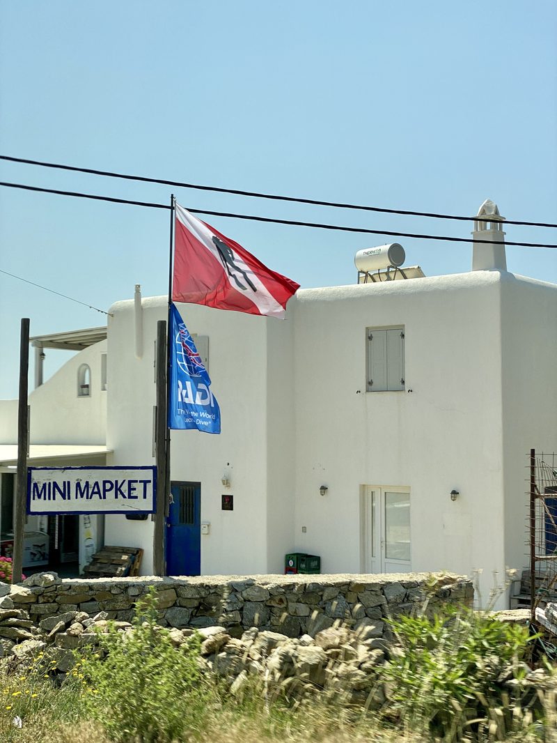A dive shop in Mykonos, Greece, with scuba gear and diving equipment on display.